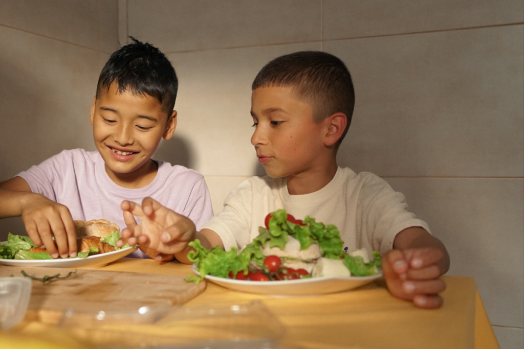 Steps to eating resource - two young boys eating salad
